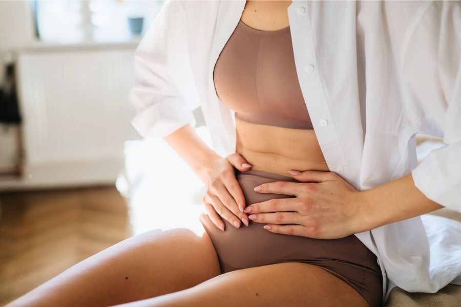 Untitled design – 2025-08-11T162209.851 woman suffering from pelvic pain