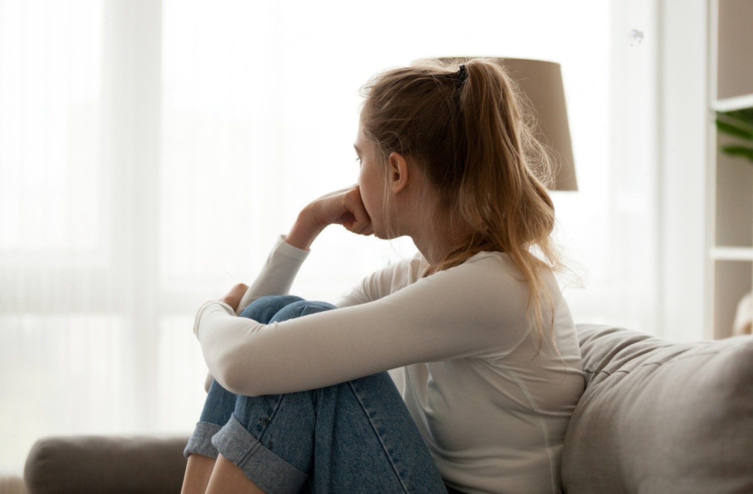 stock-photo-side-view-young-woman-looking-away-at-window-sitting-on-couch-at-home-frustrated-confused-female-1196187574-transformed fibromyalgia patient